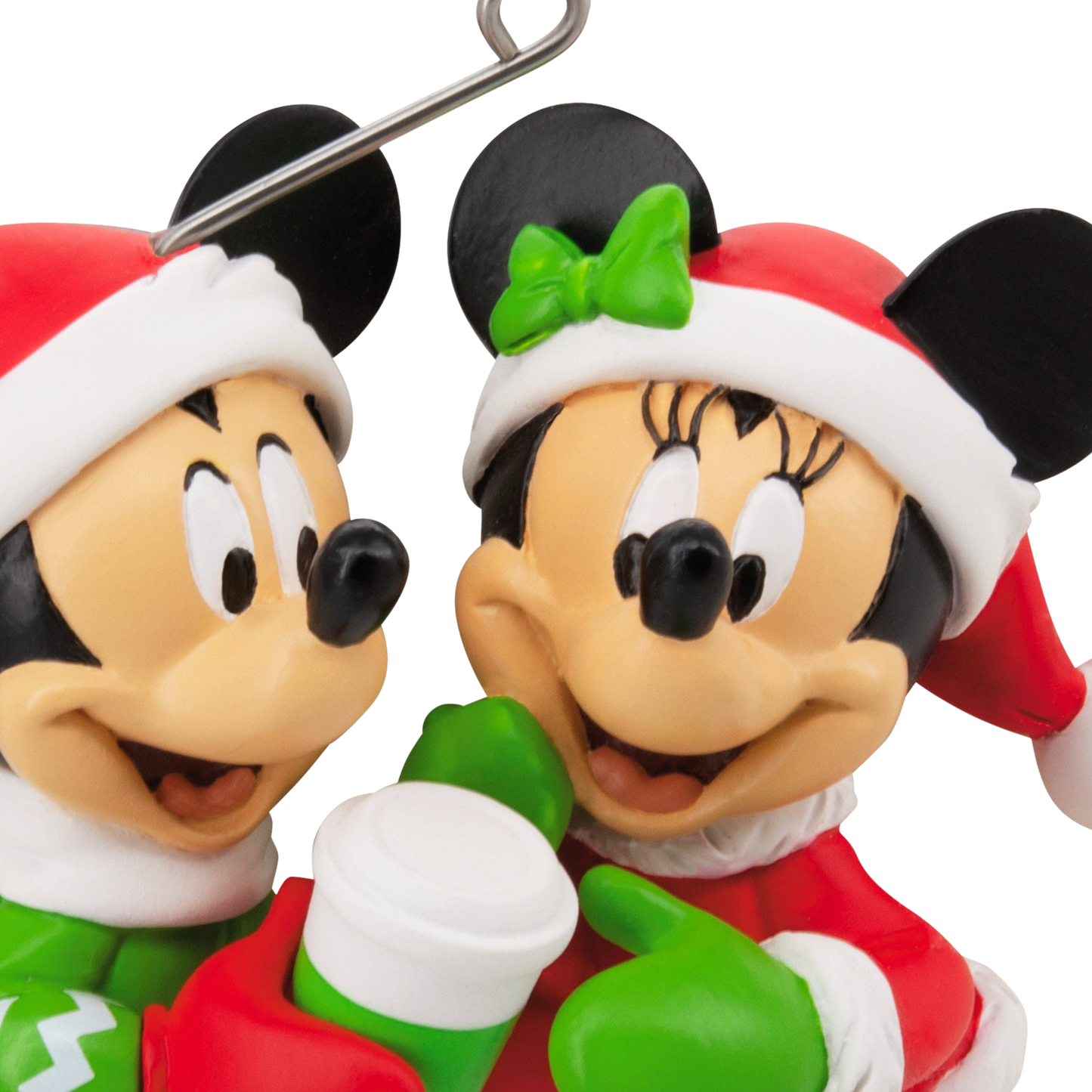 Mickey & Minnie Mouse figures in festive red and green attire hanging ornaments close up of faces