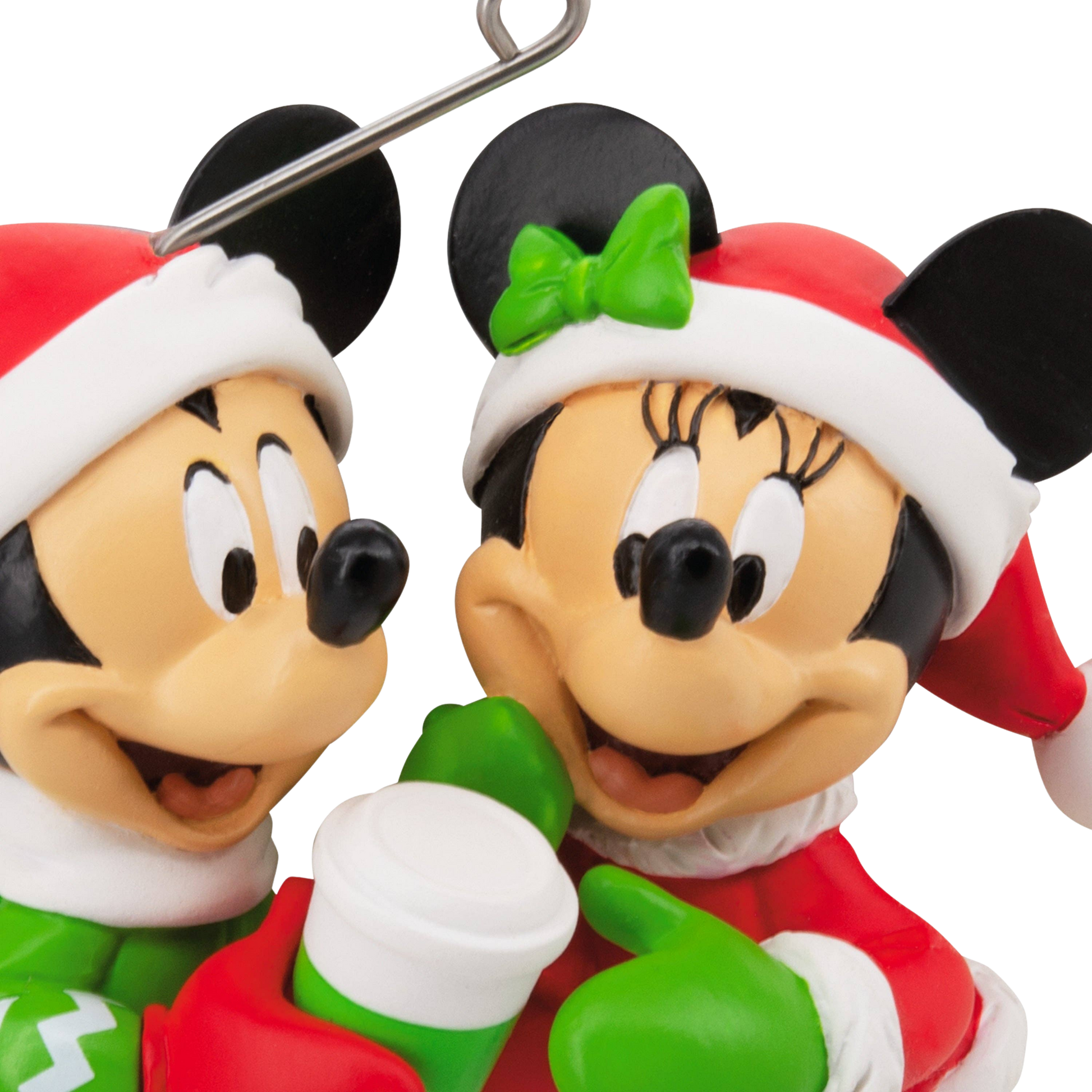 Mickey & Minnie Mouse figures in festive red and green attire hanging ornaments close up of faces