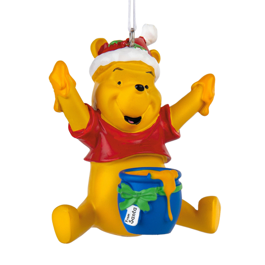 Winnie the Pooh wearing a Christmas hat with a bowl of honey Christmas ornament